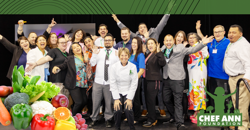 A group of people smiling and excited looking at the camera.